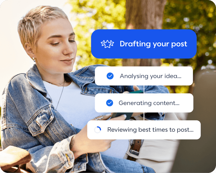 Person with short blonde hair in denim jacket using social media app showing "Drafting your post" progress interface outdoors.