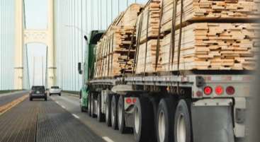 Image of a truck transporting cargo over a bridge
