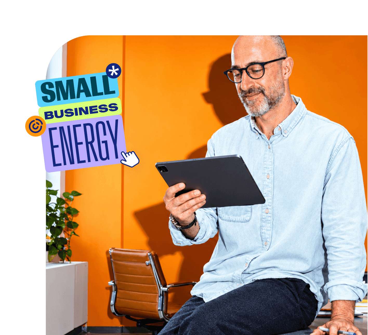 Man with glasses using a tablet in an orange office, beside a Small Business Energy graphic overlay.