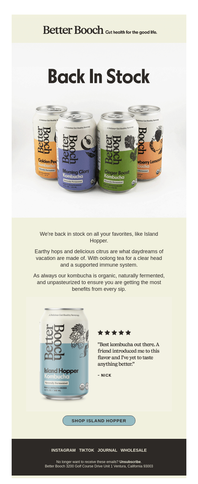 An image of a Better Booch back-in-stock promotional email showing a collection of canned kombucha flavors and an Island Hopper kombucha can paired with a customer review and a purchase CTA.