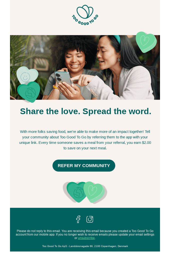 A screenshot showing a referral email by Too Good To Go with two women smiling while looking at a smartphone. Also, it displays green heart graphics and a CTA that prompts readers to refer their community. 