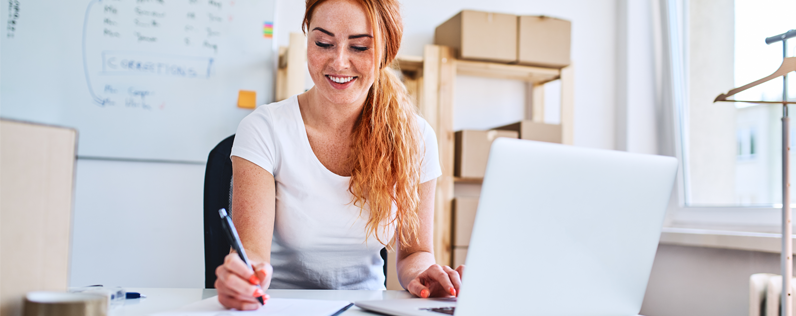 How often to send email blog header female business owner on laptop