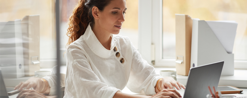 Business woman adding buttons to emails