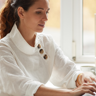 Business woman adding buttons to emails