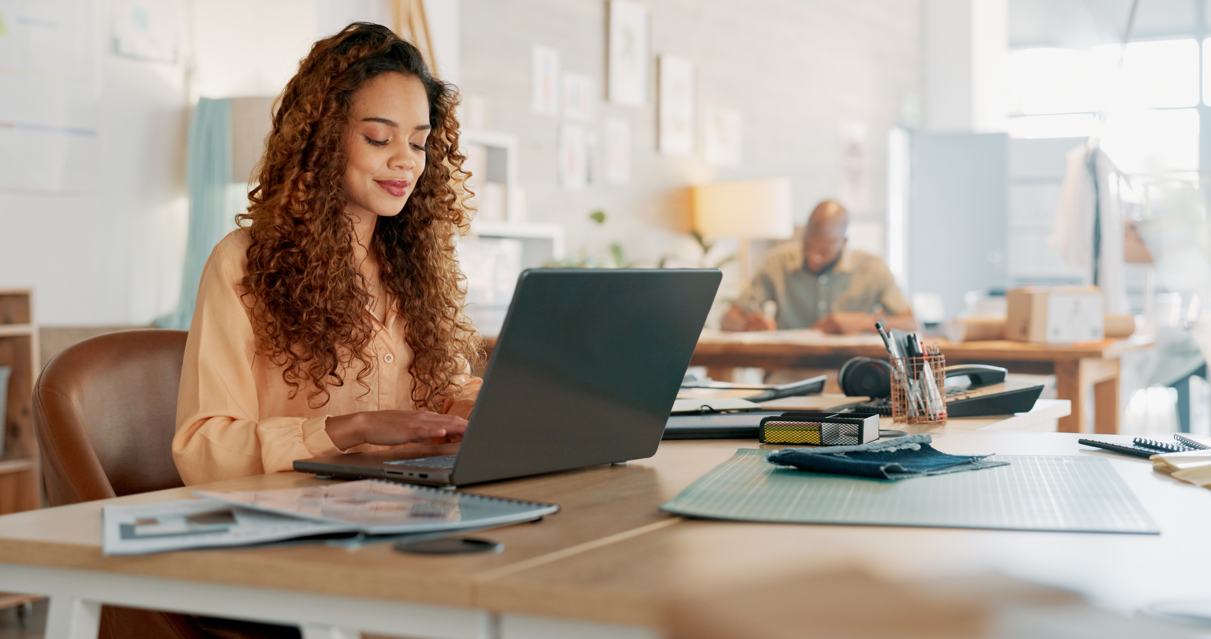 woman at desk working at laptop woman at desk working at laptop