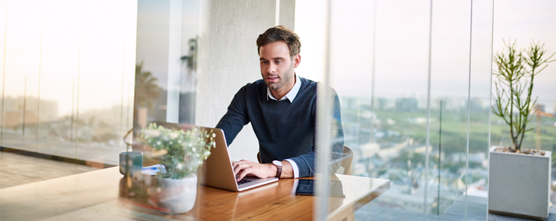 Millennial Marketing Blog header Male professional on laptop
