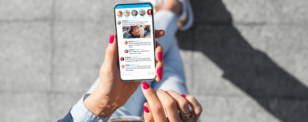 POV: You're standing on a sidewalk looking down at your smartphone.