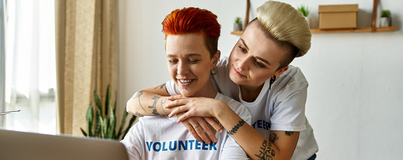 Anniversary Email Blog header Nonprofit volunteers on laptop