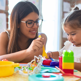 Childcare worker with two small children