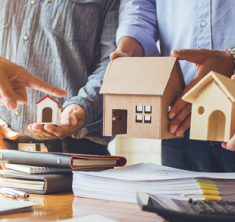 Realtors holding model home