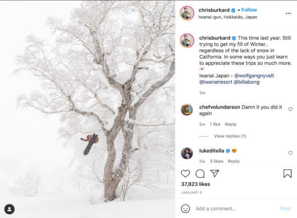 Best Travel Instagrams - Snowy image of Chris Burkard on a snowboard jumping out of a frost covered tree