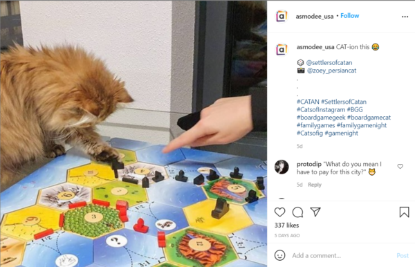 Get people talking with board game marketing that uses posts like this one that has an image of a cat moving a playing piece and text saying "CAT-ion this"