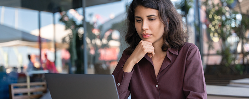 Email subject lines for real estate blog header Female professional work on laptop