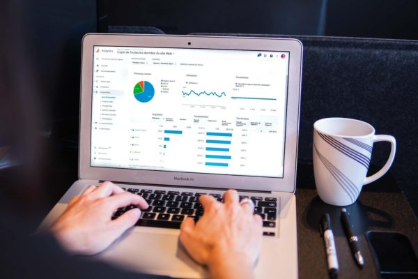 laptop screen showing tracking data and graphs