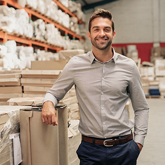 B2B Business owner standing in warehouse