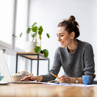 A thumbnail of a woman at a laptop.