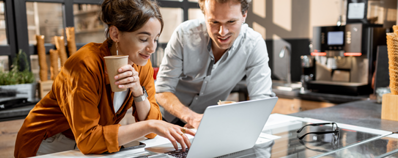 Shop owners working on Facebook business page