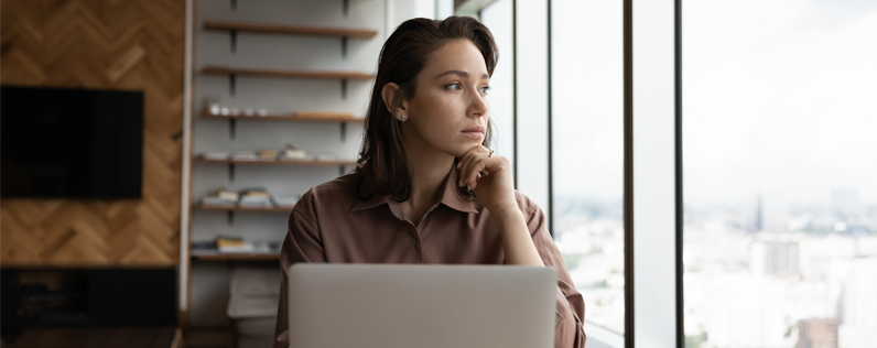 Business owner sitting at desk working on sending mass email in gmail