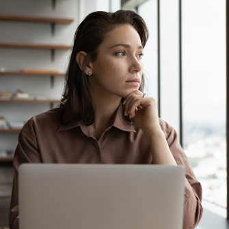 Business owner sitting at desk working on sending mass email in gmail