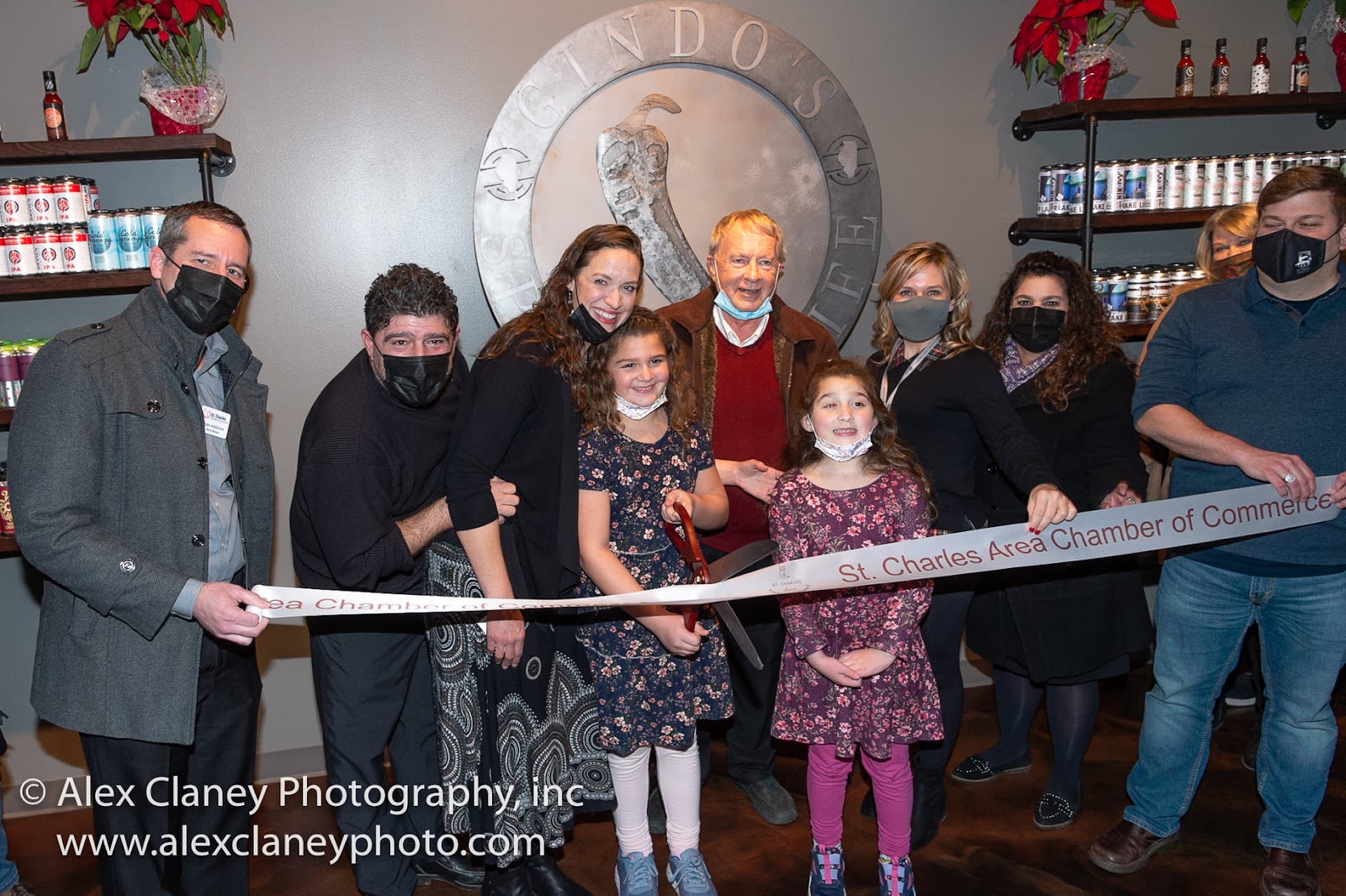 The Ginder’s pose for a photo at the Gindo’s Spice of Life ribbon cutting with the St. Charles Area Chamber of Commerce.