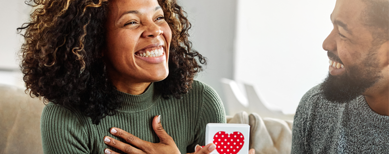 Man giving signifcant other a valentine's card