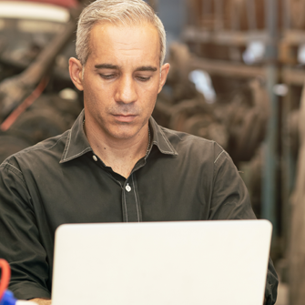 Man on laptop whitelisting email addresses