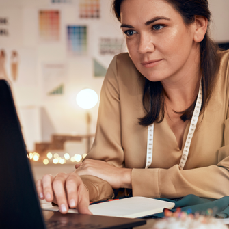 Boutique owner working on laptop