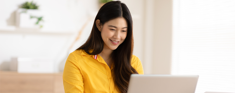 Email footer examples blog header Woman working on email design on laptop