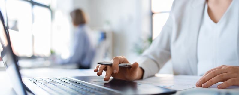 Email footers blog header Female hands typing on laptop