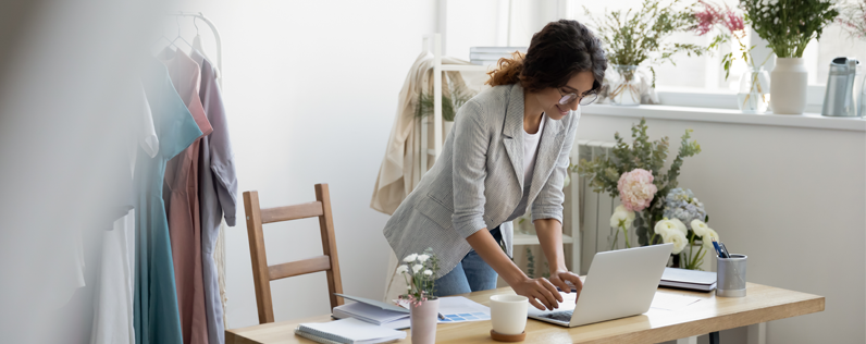 Triggered Email Blog header Business woman working at desk