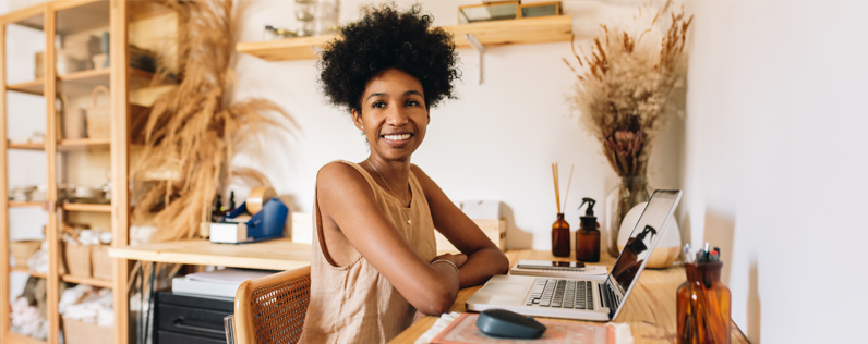 Shop owner working on nurture emails on laptop