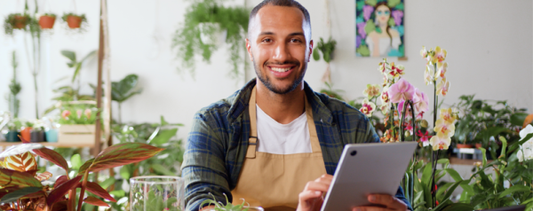 Shop owner working on post-purchase emails on ipad