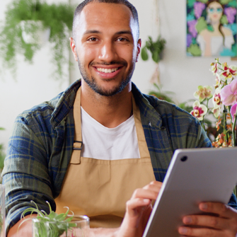 Shop owner working on post-purchase emails on ipad