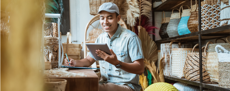 Shop owner working on ipad