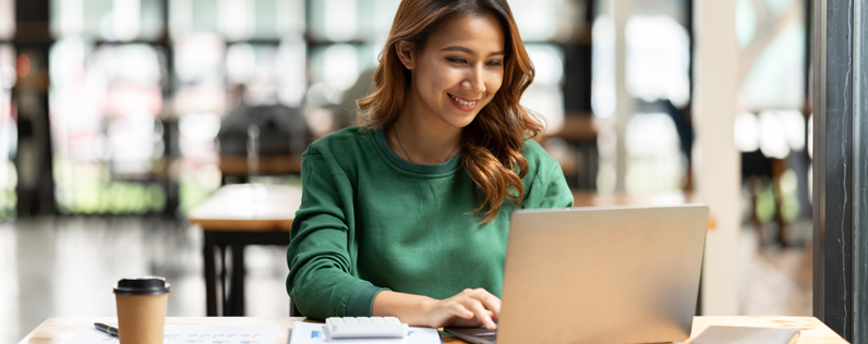 Email Services Blog header Female marketer on laptop