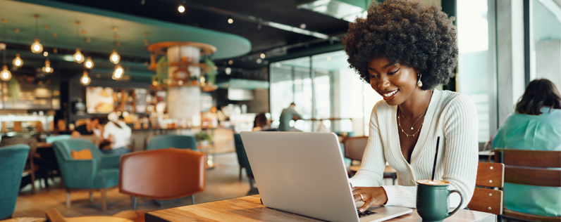 What is Freelance Digital Marketing Blog header Women working on laptop in a cafe