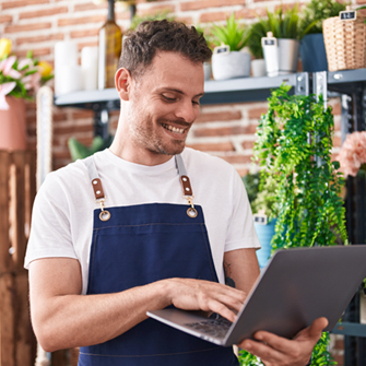 Male flower shop owner working on a welcome email