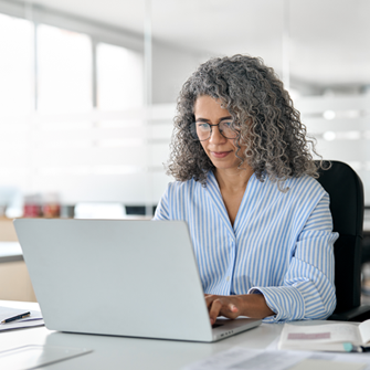 Insurance marketer working on laptop