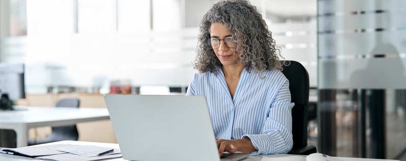 Insurance marketer working on laptop