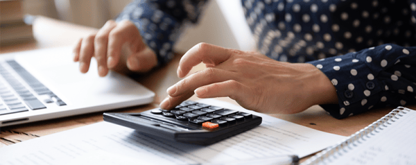 Woman using calculator
