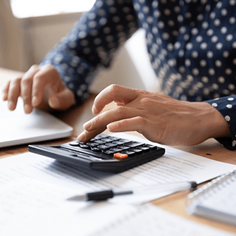 Woman using calculator