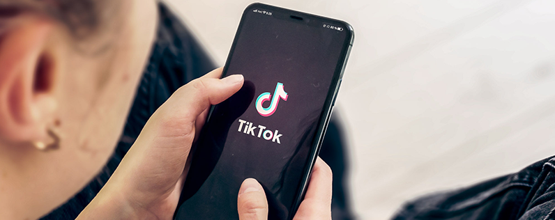 TikTok Ban Blog header Woman on TikTok