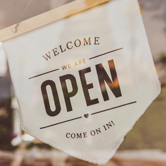 An open sign in a window of a business.