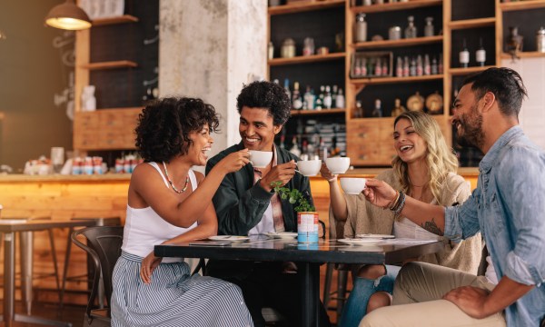 group of people having coffee at a cafe
