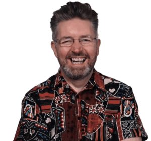 A headshot of email marketing consultant Ian Brodie with a wide smile.