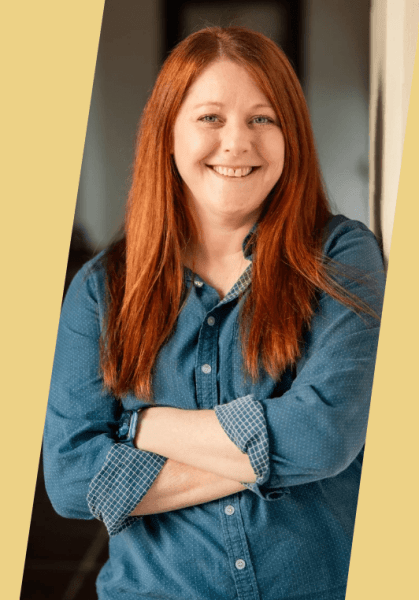 Email deliverability expert Lauren Meyer posing with crossed arms,  smiling.