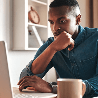 A man looking at his laptop