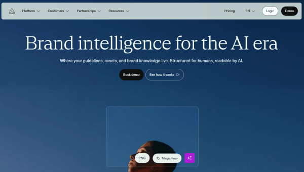 Frontify homepage displaying the headline "Brand intelligence for the AI era" above a digital asset preview, with options to book a demo or explore the platform.