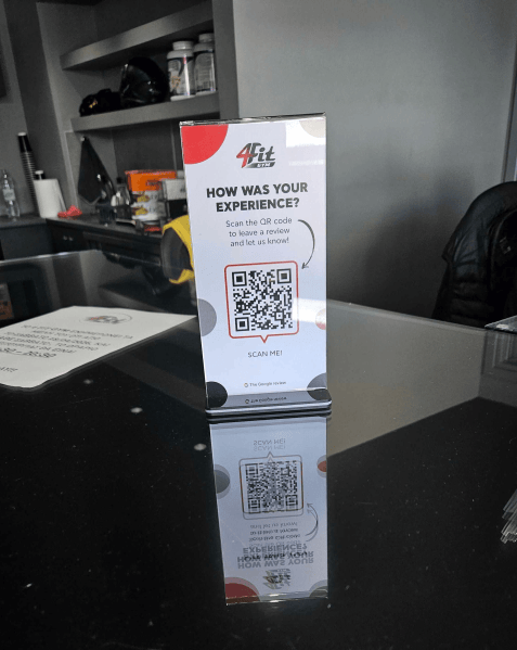 4Fit Gym encourages members to share their experience with a QR code displayed at the front desk. 